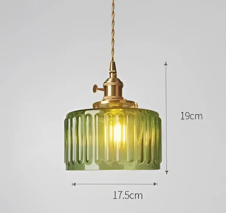 Translucent blue glass pendant light with brass fixture for dining room