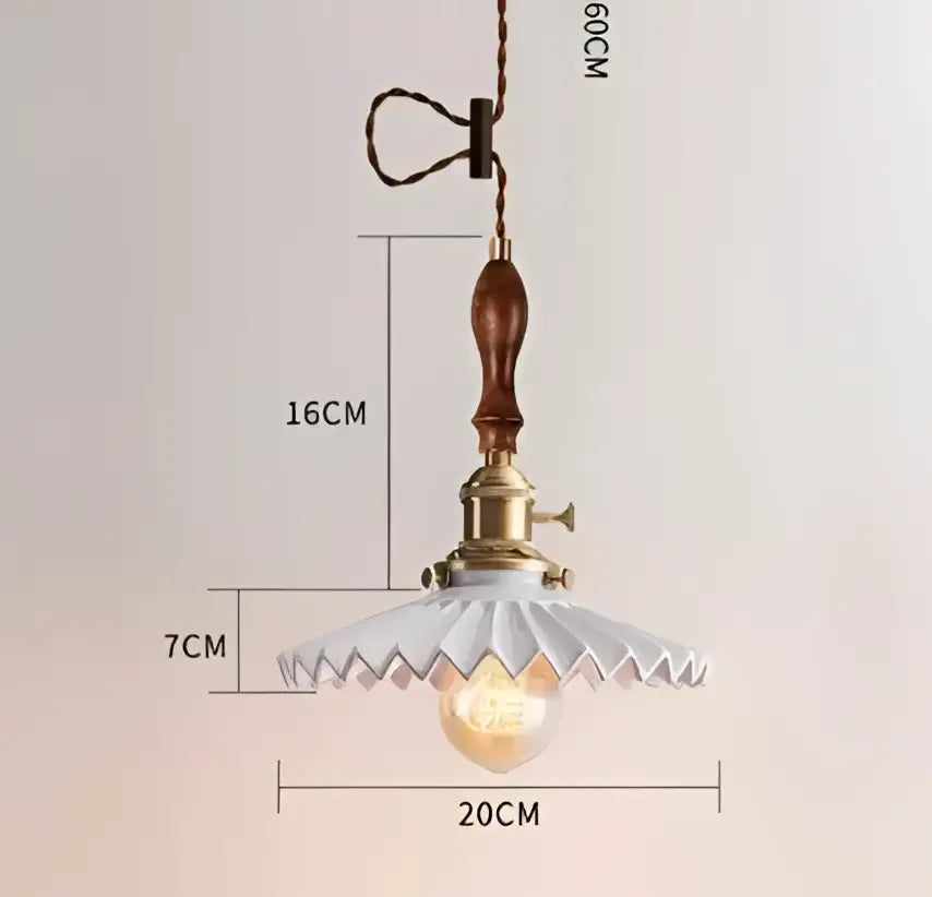 Translucent blue glass pendant light with brass fixture for dining room
