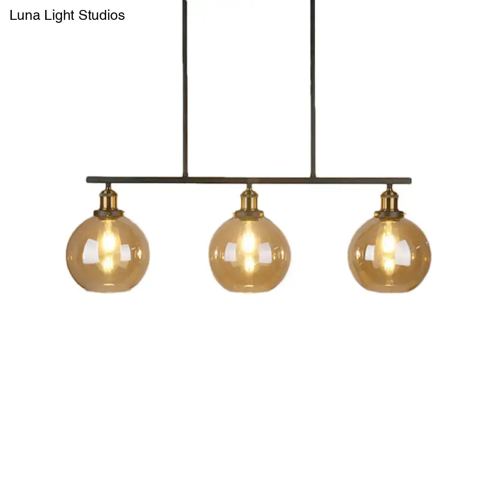 Vintage amber glass 3-light black and brass pendant dining room lamp