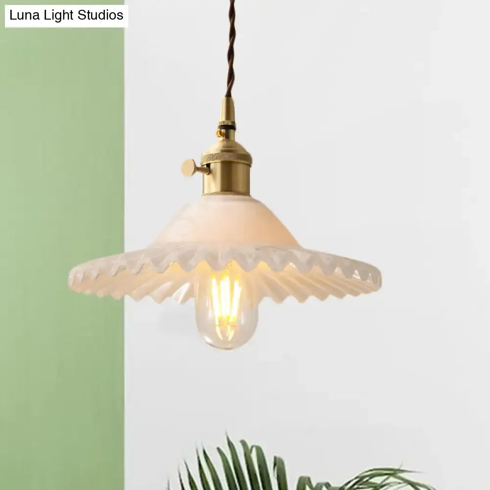 Vintage-style DecorBites™ Chloe scalloped pendant light with brass metal fixture and off-white glass shade