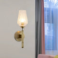 Vintage brass wall light with ribbed textured glass shade, a stylish bedroom sconce fixture measuring inches fixture