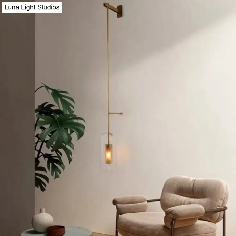 Vintage brass wall lamp with clear glass cylinder – living room sconce