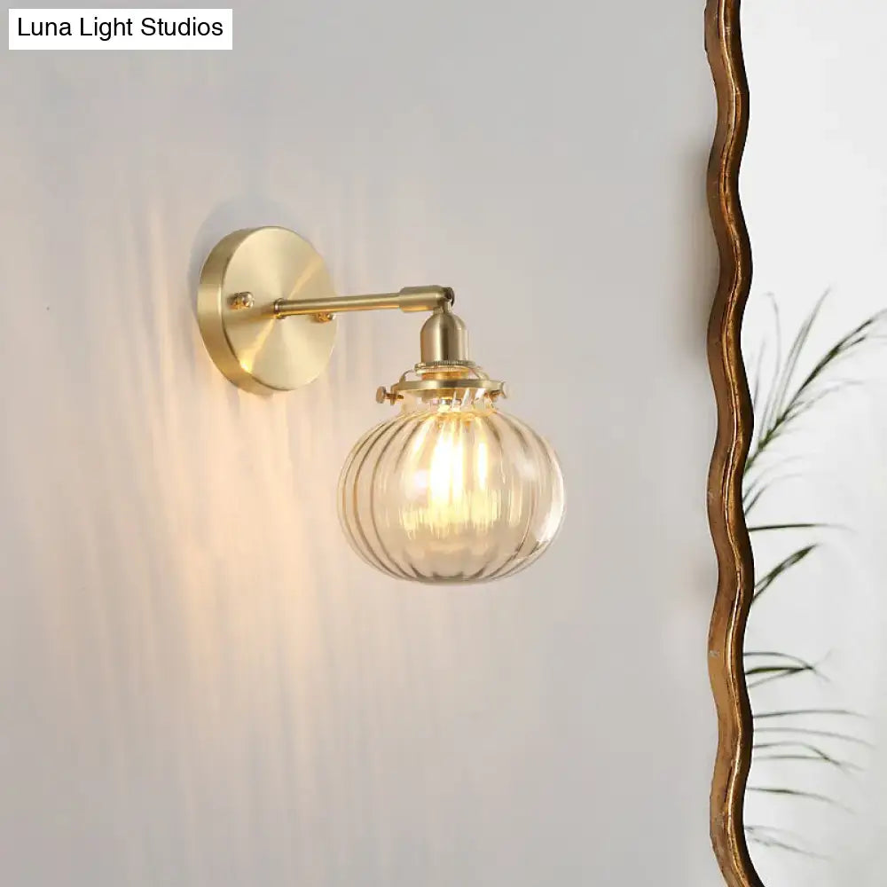 Vintage brass wall light with champagne & clear glass shade bedroom