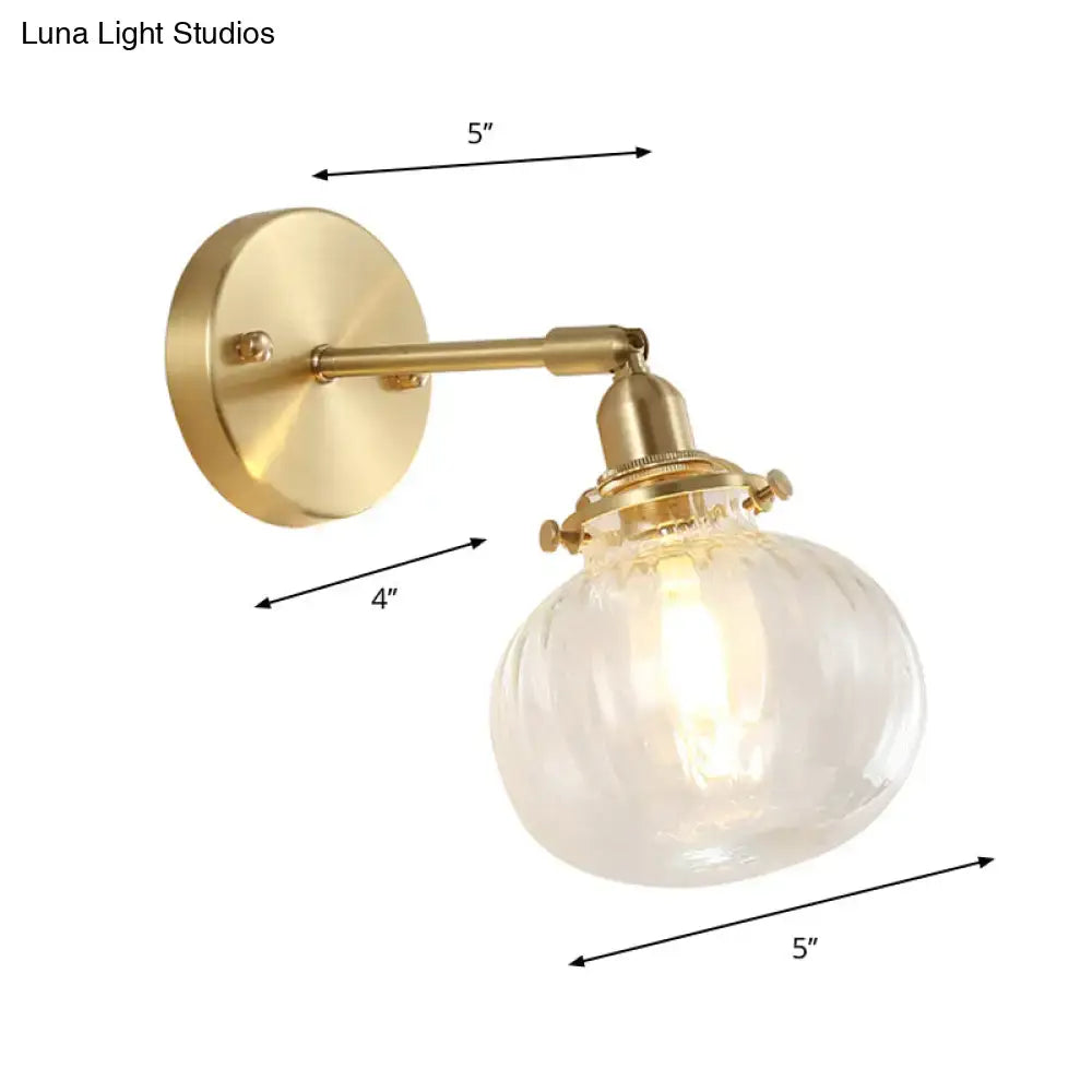 Vintage brass wall light with champagne & clear glass shade bedroom
