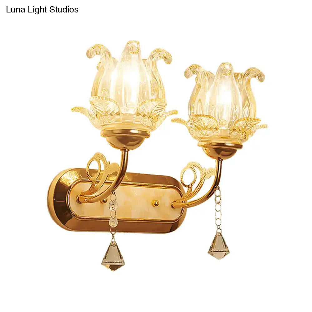 Vintage gold flower wall sconce with amber glass shade bedroom light