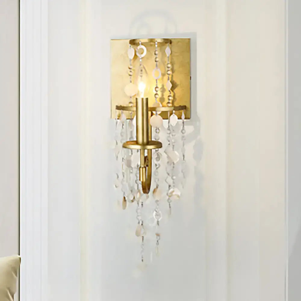 Vintage style gold wall sconce with crystal beaded strand bedroom light