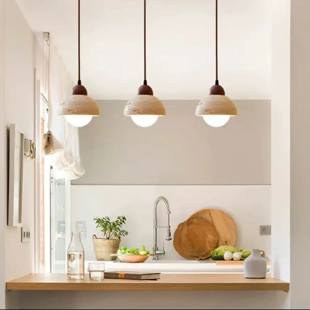 Warm textured concrete cave stone pendant light dining room