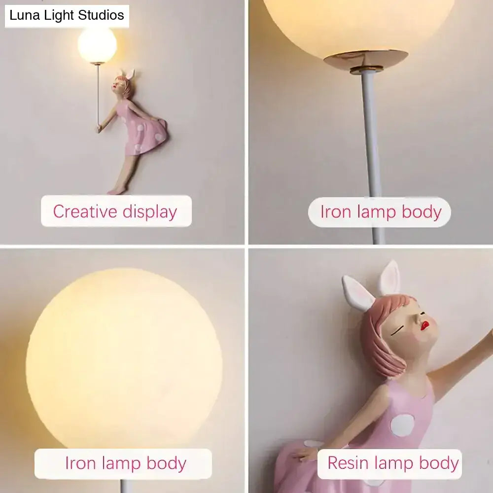 Whimsical pink resin girl wall lamp with bunny ears and polka dot dress for bedroom decor lighting