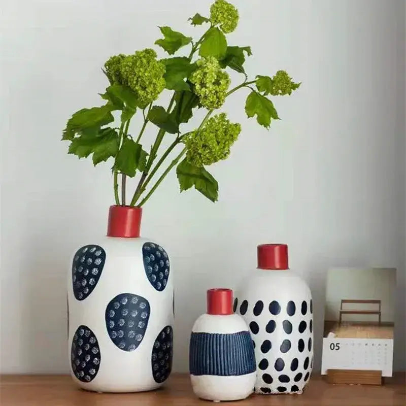 White ceramic polka dot vase with colorful graffiti lines living room