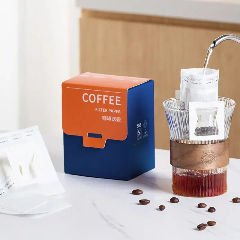 White disposable coffee filter bags kitchen pour over setup