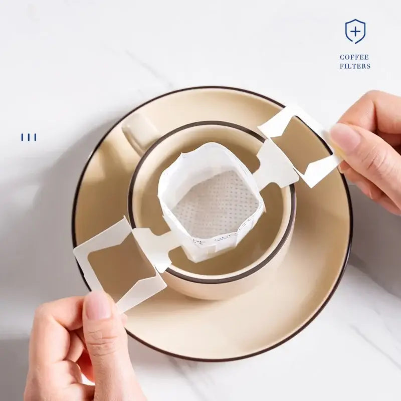 White disposable coffee filter bags kitchen pour over setup