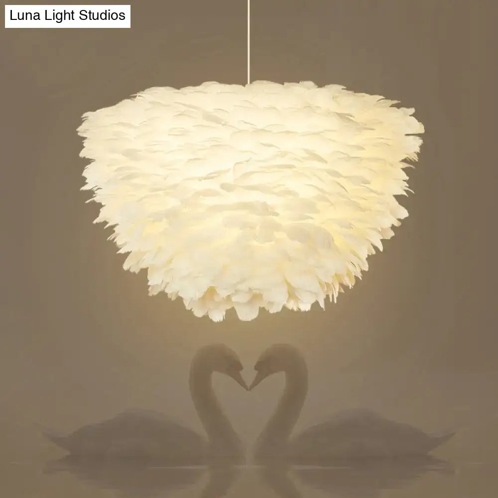 White floral pendant chandelier with feather accents for dining room