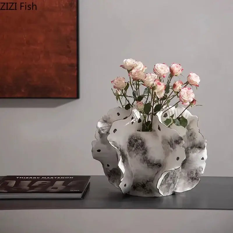 White & gray ruffled ceramic vase with artificial flowers living room