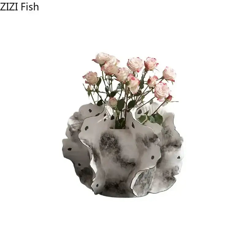 White & gray ruffled ceramic vase with artificial flowers living room