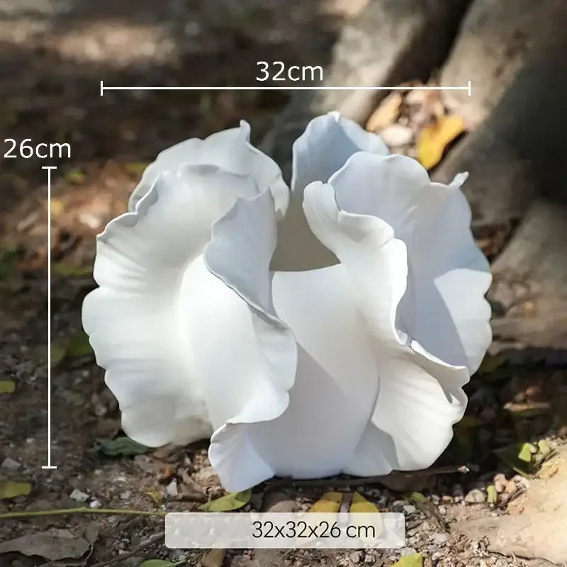 White & gray ruffled ceramic vase with artificial flowers living room