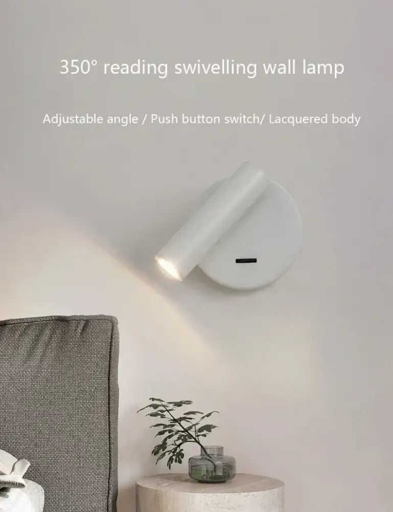 White lacquered swivelling bedroom wall lamp with push button switch