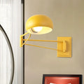 Yellow adjustable metal wall sconce with bowl shade for bedroom