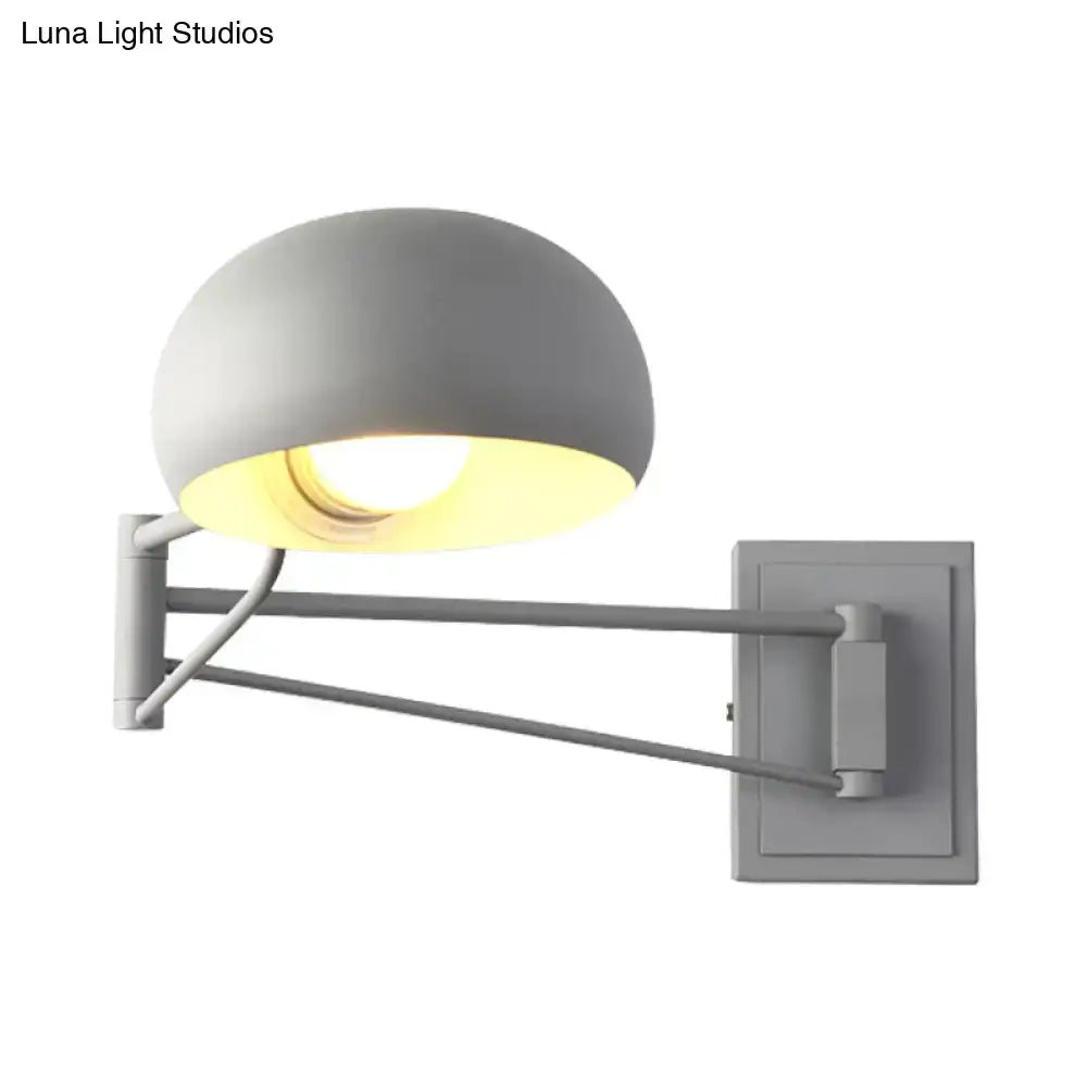 Yellow adjustable metal wall sconce with bowl shade for bedroom