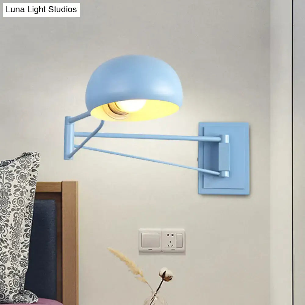 Yellow adjustable metal wall sconce with bowl shade for bedroom