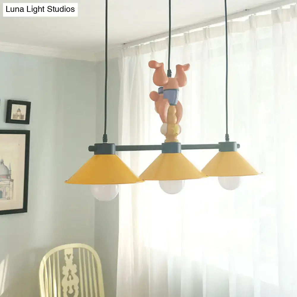 Yellow and orange monkey kitchen island pendant with yellow cone shades