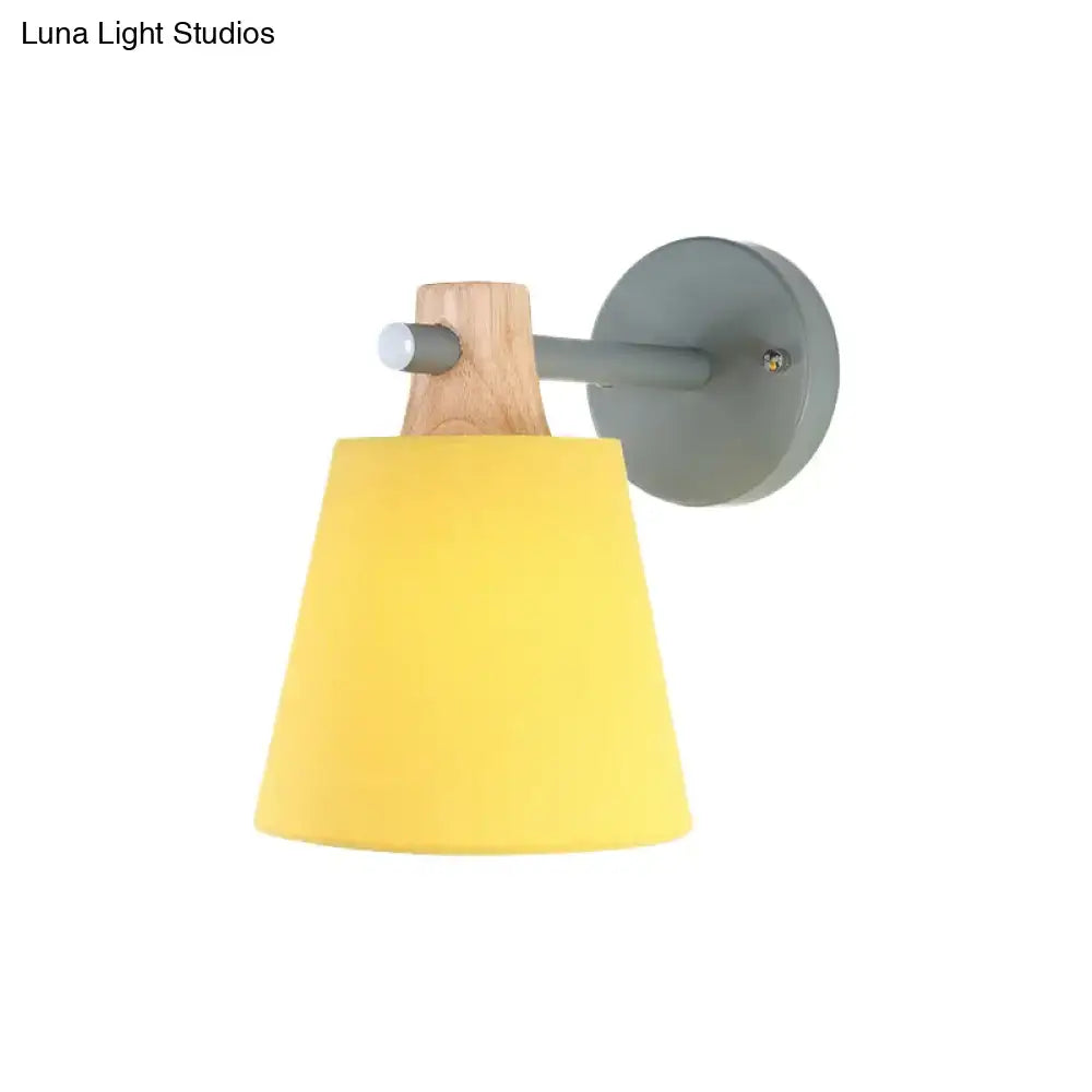 Yellow macaron fabric wall light with wood accent bedroom sconce